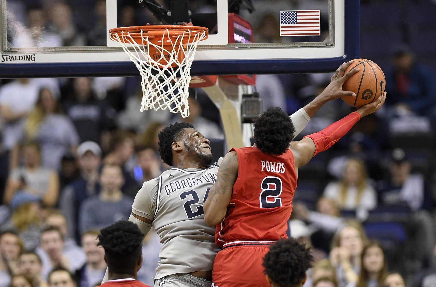Georgetown forward Marcus Derrickson (24) blocks St. John's guard Shamorie Ponds (2) during the first overtime of an NCAA college basketball game, Saturday, Jan. 20, 2018, in Washington. Georgetown won 93-89 in double overtime. (AP Photo/Nick Wass)