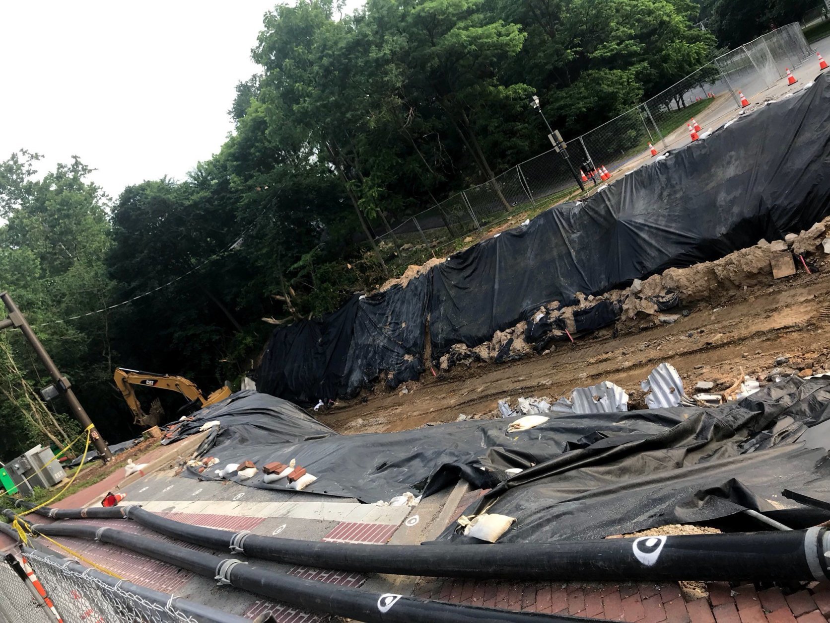 Looking from Main Street over the washed-out stretch of Ellicott Mills Drive. Howard County says that it will still be several months until the road reopens. (WTOP/Neal Augenstein)