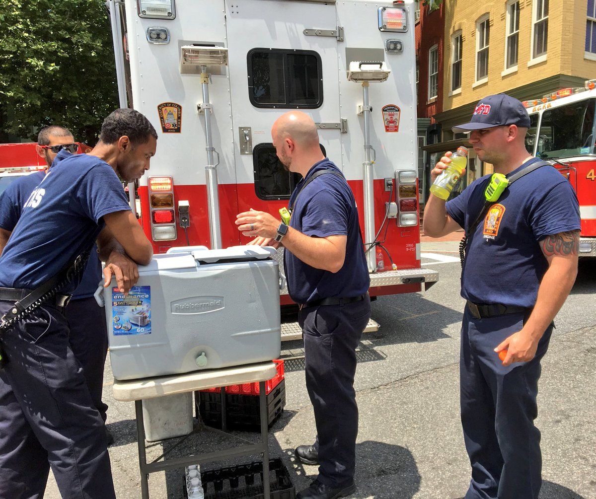 DC Fire and EMS tweeted that the firefighters are undergoing rehabilitation from the intense heat of the day and the fire, and are in the process of re-hydrating and cooling down. (Courtesy DC Fire and EMS)