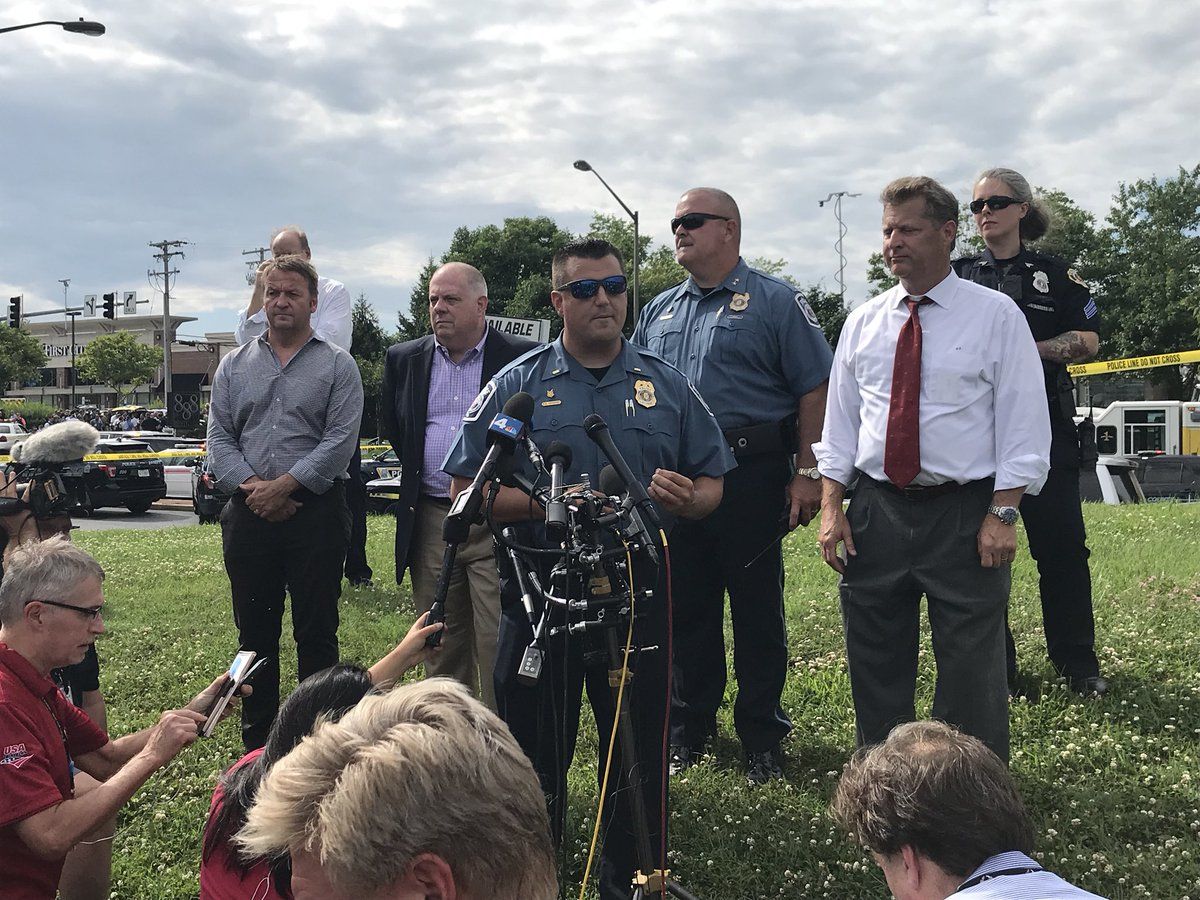 A police briefing with Anne Arundel County Executive Steve Schuh and Anne Arundel County Police spokesman Lt. Ryan Frashure in the aftermath of an active shooting situation at the Capital Gazette building, 888 Bestgate Road, in Annapolis, Maryland, Thursday afternoon.  (WTOP/Michelle Basch)