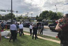 Police blocked a perimeter and held people back from the scene of an active shooting at the Capital Gazette building, 888 Bestgate Road, in Annapolis, Maryland, Thursday afternoon.  (WTOP/Michelle Basch)