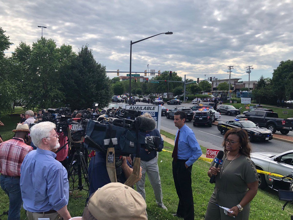Press and media has set up across the street from the building housing the Capital Gazette, in Annapolis, Maryland. (WTOP/Megan Cloherty)