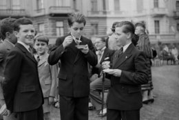 4th July 1939:  Robert Kennedy (1925-1968) ( on the left) eating ice-cream with John Sheffield in the garden of the American embassy in London during the time when his father, Joseph Kennedy was ambassador to Great Britain.  (Photo by Fox Photos/Getty Images)