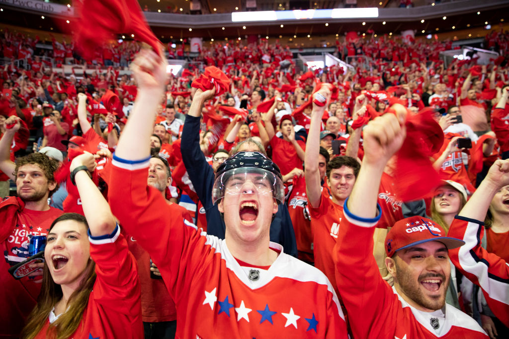 WASHINGTON, DC - JUNE 07: A Washington Capitals fans cheer during the fan watch party at Capitol One Area on June 7, 2018 in Washington, DC. The Washington Capitals head into Game 5 tonight against the Las Vegas Golden Knights with a  3-1 series lead. (Photo by Alex Edelman/Getty Images)
