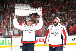 LAS VEGAS, NV - JUNE 07:  Alex Ovechkin #8 hands of the Stanley Cup to Nicklas Backstrom #19 of the Washington Capitals after their team's 4-3 win over the the Vegas Golden Knights in Game Five of the 2018 NHL Stanley Cup Final at T-Mobile Arena on June 7, 2018 in Las Vegas, Nevada.  (Photo by Bruce Bennett/Getty Images) *** Local Caption *** Nicklas Backstrom; Alex Ovechkin