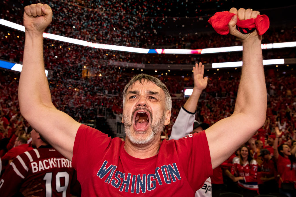 WASHINGTON, DC - JUNE 07: A Washington Capitals fan celebrates after the Washington Capitals win Game 5 of the Stanley Cup Final against the Vegas Golden Nights to capture the Stanley Cup during a watch party at Capitol One Area on June 7, 2018 in Washington, DC. The Washington Capitals defeated the Vegas Golden Knights 4-3. (Photo by Alex Edelman/Getty Images)
