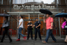 NEW YORK, NY - JUNE 28: Members of the New York City Police Department stand outside the headquarters of The New York Times, June 28, 2018 in New York City. NYPD announced increased security in Manhattan at major media companies following a shooting today at the Capital Gazette newspaper in Maryland. (Photo by Drew Angerer/Getty Images)