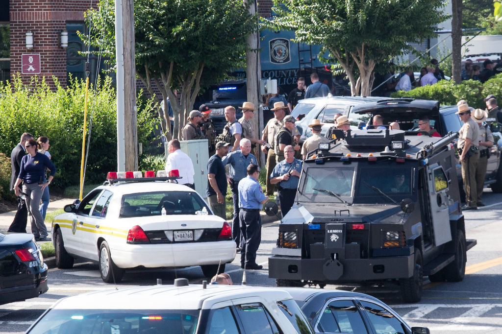 ANNAPOLIS, MARYLAND - JUNE 28, 2018: Police respond to a shooting on June 28, 2018 in Annapolis, Maryland. - At least five people were killed Thursday when a gunman opened fire inside the offices of the Capital Gazette, a newspaper published in Annapolis, a historic city an hour east of Washington. A reporter for the daily, Phil Davis, tweeted that a 'gunman shot through the glass door to the office and opened fire on multiple employees.''There is nothing more terrifying than hearing multiple people get shot while you're under your desk and then hear the gunman reload,' Davis said. (Photo by Alex Wroblewski/Getty Images)