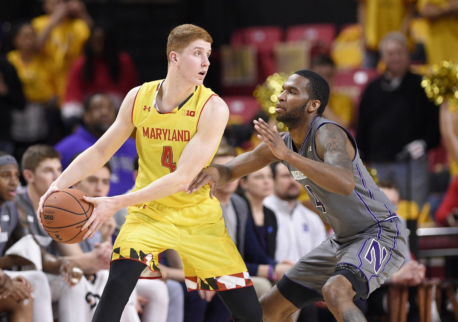Maryland guard Kevin Huerter, left, handles the ball against Northwestern forward Vic Law, right, during the first half of an NCAA basketball game, Saturday, Feb. 10, 2018, in College Park, Md. (AP Photo/Nick Wass)