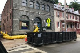 Days after the devastating flood, business owners and county officials reported solid progress Wednesday with the cleanup in Ellicott City. But a firsthand view of the damage shows that there's much work ahead and it is still unclear when Main Street can reopen. (WTOP/Dick Uliano)