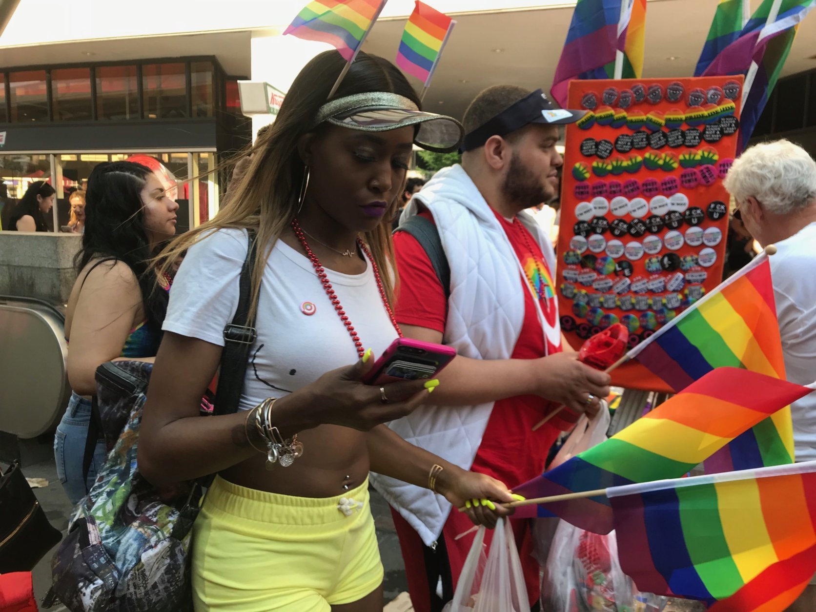 Holding rainbow flags, parade-attendees march on and celebrate Pride Month at D.C.'s Pride Parade. (WTOP/Dick Uliano)