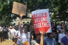 Under a scorching sun, a big crowd of demonstrators jammed Lafayette Park and spilled over into Farragut Square to protest the Trump administration's immigration policies for the "Families Belong Together" march and rally Saturday in downtown D.C. (WTOP/Dick Uliano)