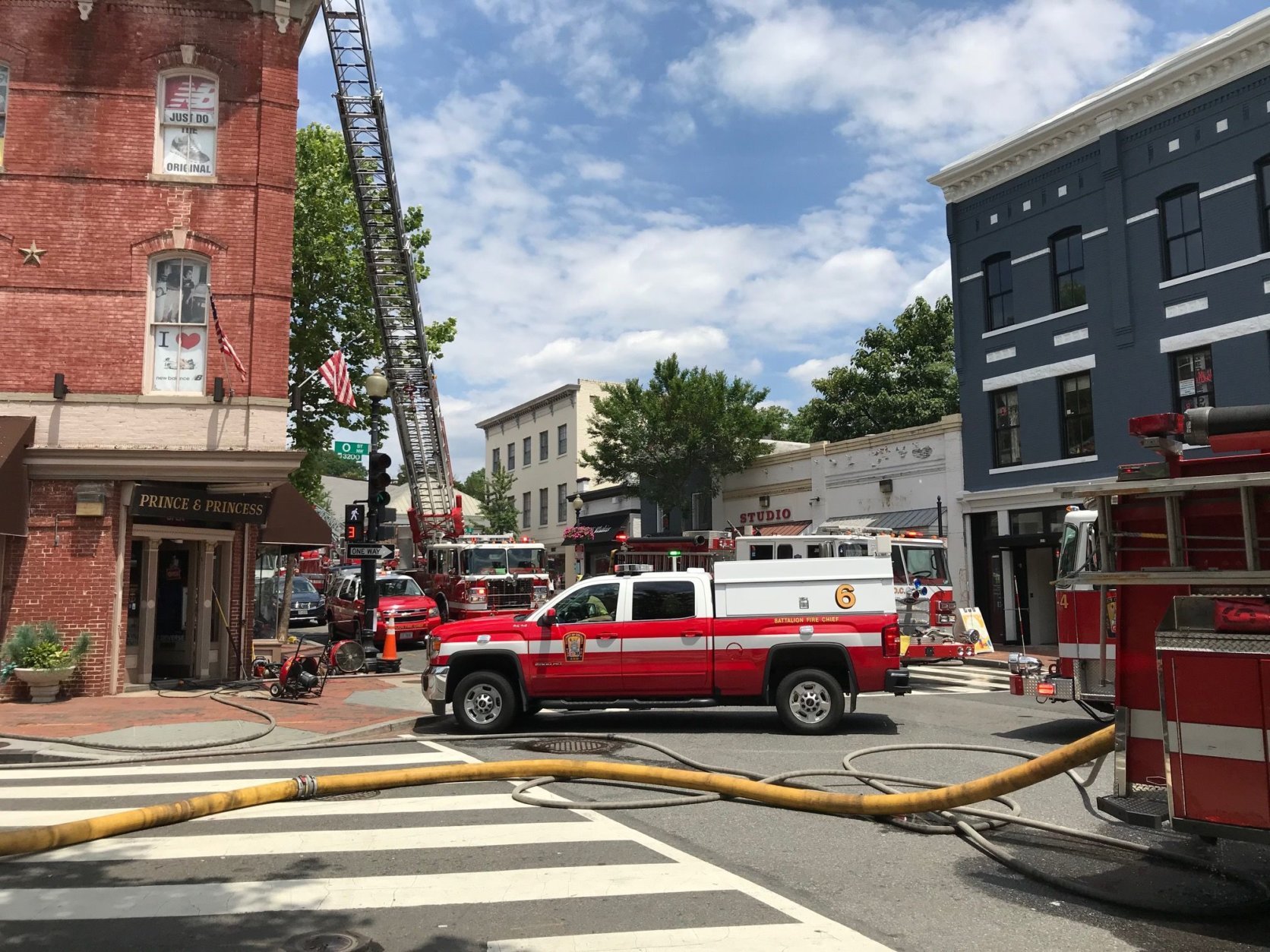 Firetrucks blocked Wisconsin Avenue temporarily while DC Fire and EMS extinguished the flames. (Courtesy Kent Barnes)