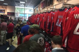 Customers shop for gear a day after the Caps win the Stanley Cup Finals
