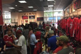 Customers shop for gear a day after the Caps win the Stanley Cup Finals