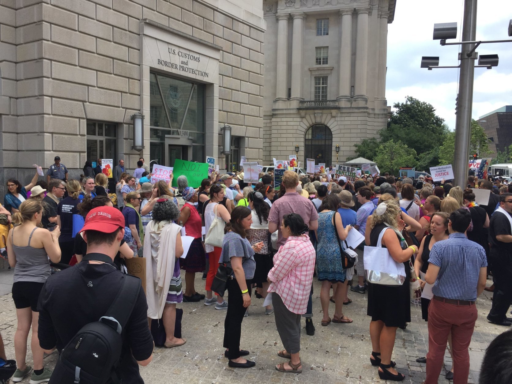 A large group of women chanted "let the children go...now" and spoke against President Trump's "zero tolerance" immigration policy outside of the United States Customs and Border Protection headquarters in D.C. on Tuesday. (Photo by Don Squires)
