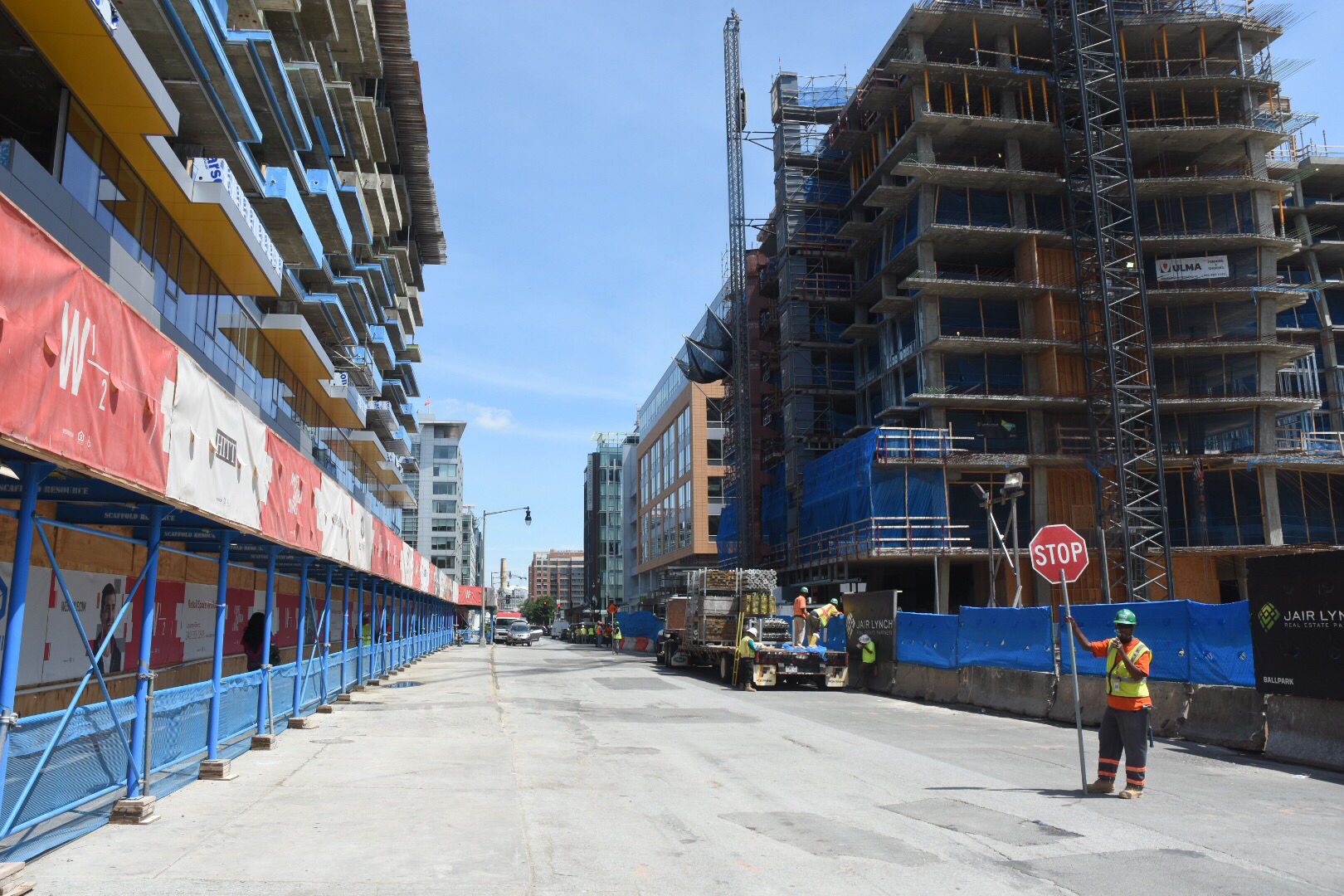 In front of Center Field Gate, the two mixed use buildings under construction will eventually have nearly 1,000 residential units and thousands of feet of retail space combined. For now, they are a work in progress work along Half Street SE appears only halfway complete. (WTOP/Dave Dildine)