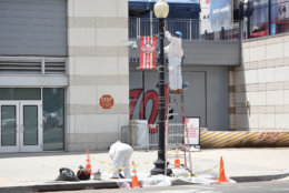 District Department of Transportation crews were seen Monday touching up the lamp posts outside Nationals Park. (WTOP/Dave Dildine)