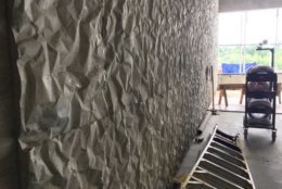 “Crinkle concrete” is acoustical concrete that was created for the REACH expansion. It allows for performance space walls that double as support walls. There’s only one column in the entire structure, and it’s a light fixture. (WTOP/Kristi King)