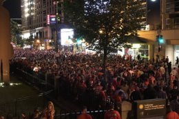 Fans of the Washington Capitals follow the Game 4 matchup outside the Capital One Arena in Washington, D.C. on Monday, June 4, 2018. (WTOP/Michelle Basch)