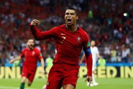 SOCHI, RUSSIA - JUNE 15:  Cristiano Ronaldo of Portugal celebrates after scoring his team's first goal during the 2018 FIFA World Cup Russia group B match between Portugal and Spain at Fisht Stadium on June 15, 2018 in Sochi, Russia.  (Photo by Dean Mouhtaropoulos/Getty Images)