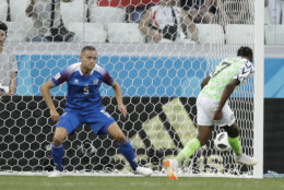 Nigeria's Ahmed Musa, right, kicks past Iceland's Sverrir Ingason to score his side's second goal during the group D match between Nigeria and Iceland at the 2018 soccer World Cup in the Volgograd Arena in Volgograd, Russia, Friday, June 22, 2018. (AP Photo/Andrew Medichini)