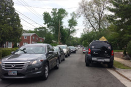 Drivers cutting through this Alexandria street with approximately 80 homes often wait long periods of time to turn onto a Duke Street service road. Apps direct them to the street, even though it is often faster to take a parallel street that has two traffic lights. (WTOP/Colleen Kelleher)