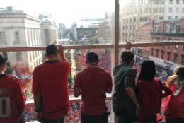 Inside Capital One Arena, looking out on the crowd-filled streets. (WTOP/Noah Frank)