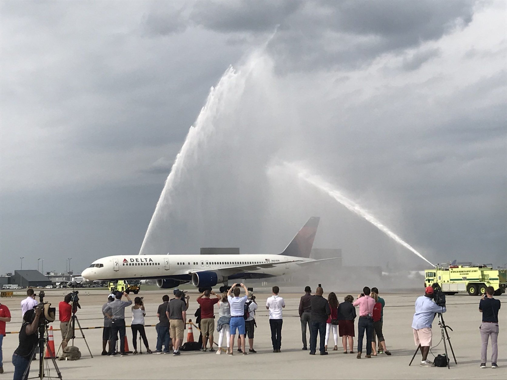 Washington Airports Authority fire trucks welcome the Caps flight back from Vegas Friday afternoon at Dulles International Airport. (WTOP/Michelle Basch)