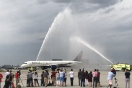 Washington Airports Authority fire trucks welcome the Caps flight back from Vegas Friday afternoon at Dulles International Airport. (WTOP/Michelle Basch)