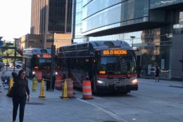 With a variety of bus routes stopping at Rosslyn, construction cones have prompted stop shifts and detours over the last several years. (WTOP/Max Smith) 
