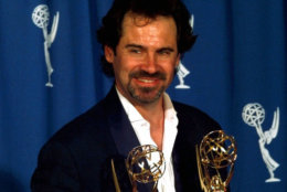 Dennis Miller holds two Emmys he won at the 48th Annual Primetime Emmy Awards in Pasadena, Calif., Sunday, Sept. 8, 1996. He won as part of a writing team in the outstanding writing for a variety or music program category and outstanding variety, music or comedy series. (AP Photo/Mark J. Terrill)