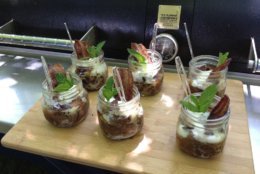 Pork Barrel Barbecue shows off its pear/bacon crisp made on the grill. (Courtesy Heath Hall)