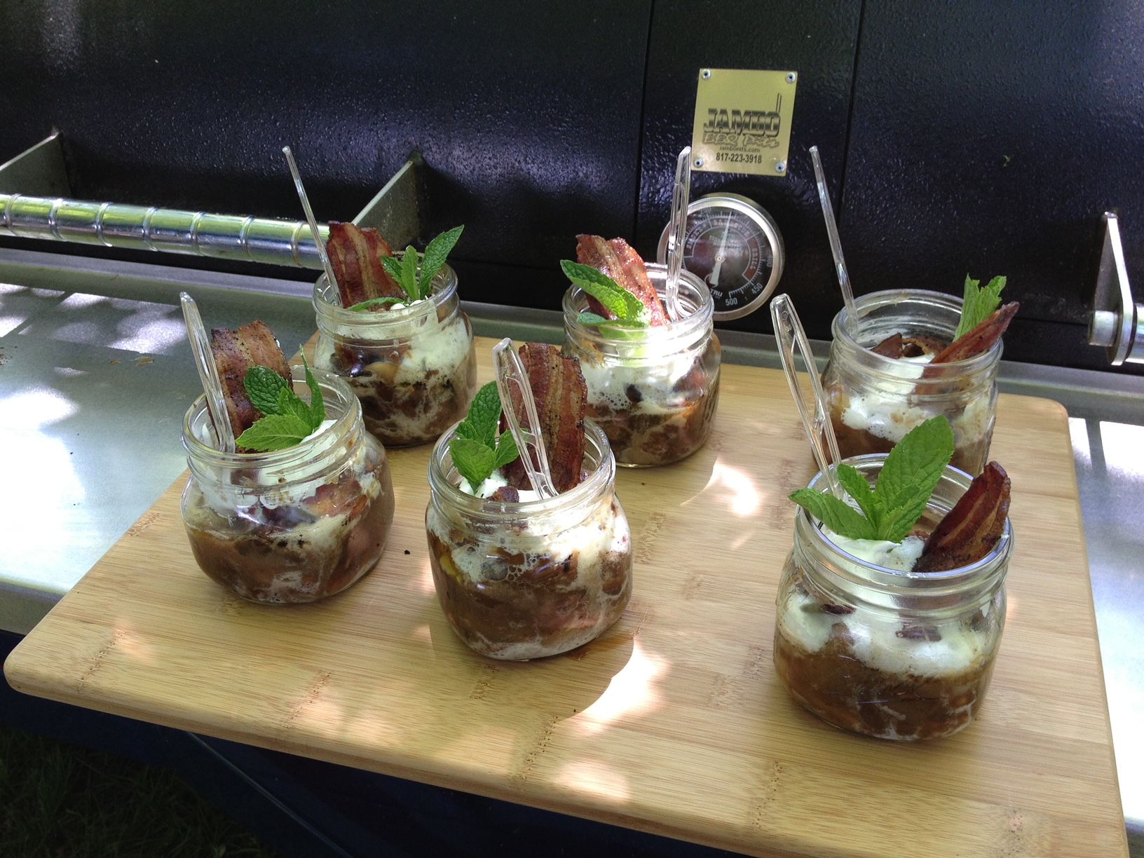 Pork Barrel Barbecue shows off its pear/bacon crisp made on the grill. (Courtesy Heath Hall)