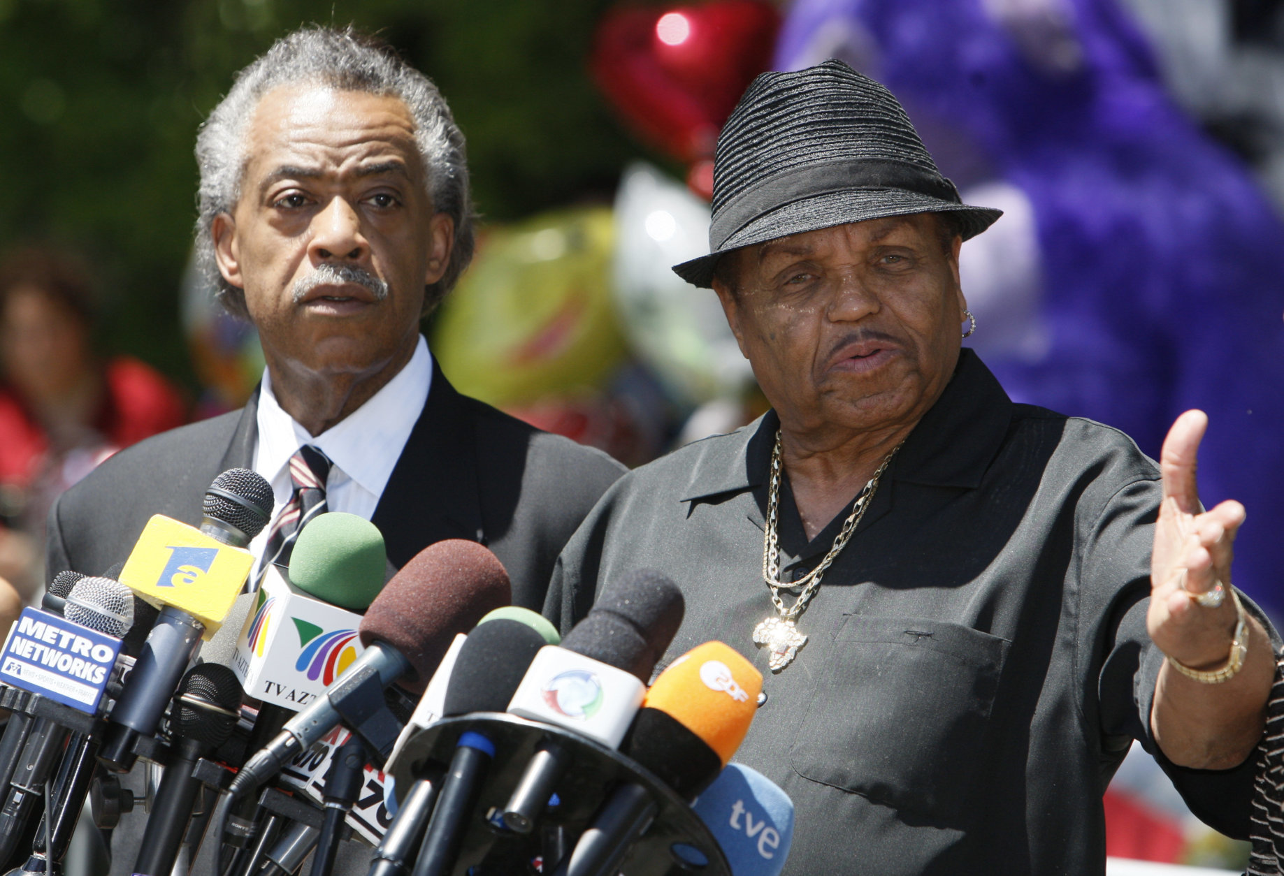 Rev. Al Sharpton and Joe Jackson, Michael Jackson's father, speak at a news conference in front of the the Jackson family residence in Encino, Calif., Monday, June 29, 2009.  (AP Photo/Charles Dharapak)