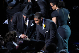 Joe Jackson,left,Usher,center,and Janet Jackson are seen at the Michael Jackson public memorial service held at Staples Center Tuesday July 7, 2009 in Los Angeles, Calif. Some 20,000 people gathered inside the Staples Center on Tuesday for a somber, spiritual ceremony (AP Photo/Kevork Djansezian, pool)