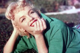 PALM SPRINGS, CA - 1954: Actress Marilyn Monroe poses for a portrait laying on the grass in 1954 in Palm Springs, California. (Photo by Baron/Getty Images)