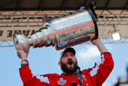 The moment everyone was waiting for: Alex Ovechkin raises the Stanley Cup on the rally stage in front of the U.S. Capitol Building on Tuesday. (AP Photo/Pablo Martinez Monsivais)