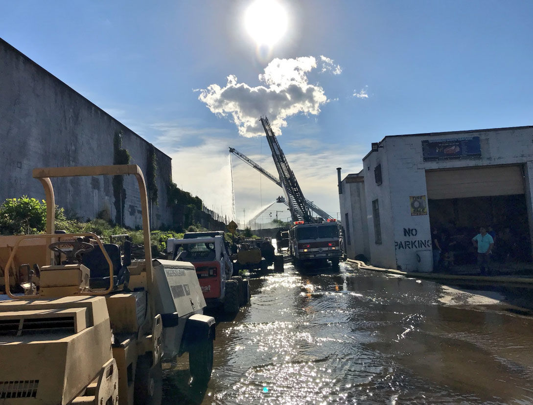 Montgomery County firefighters douse a fire that broke out at a Rockville recycling plant on Friday, June 15, 2018. (Courtesy Montgomery County Fire and Rescue)