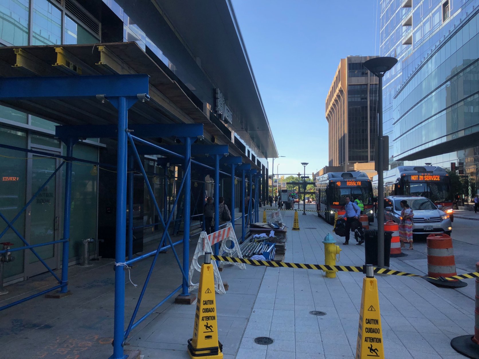 While work on the Metrobus tunnel has finished, other work near the Metro station continues, including under the sign for Nestlé’s new headquarters. (WTOP/Max Smith) 