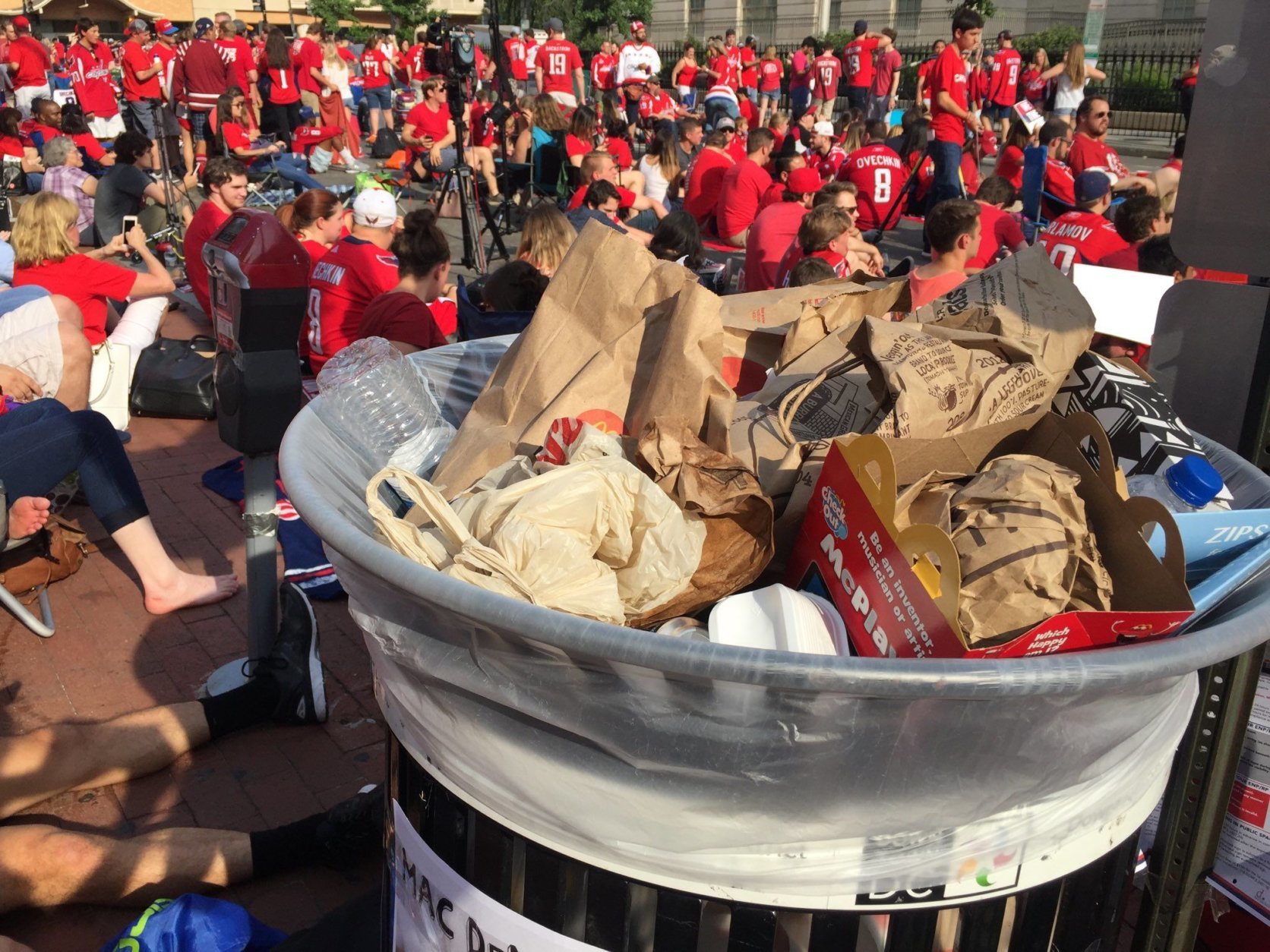 At least one trash can near Capital One Arena was at capacity hours before game time. (WTOP/Kristi King)