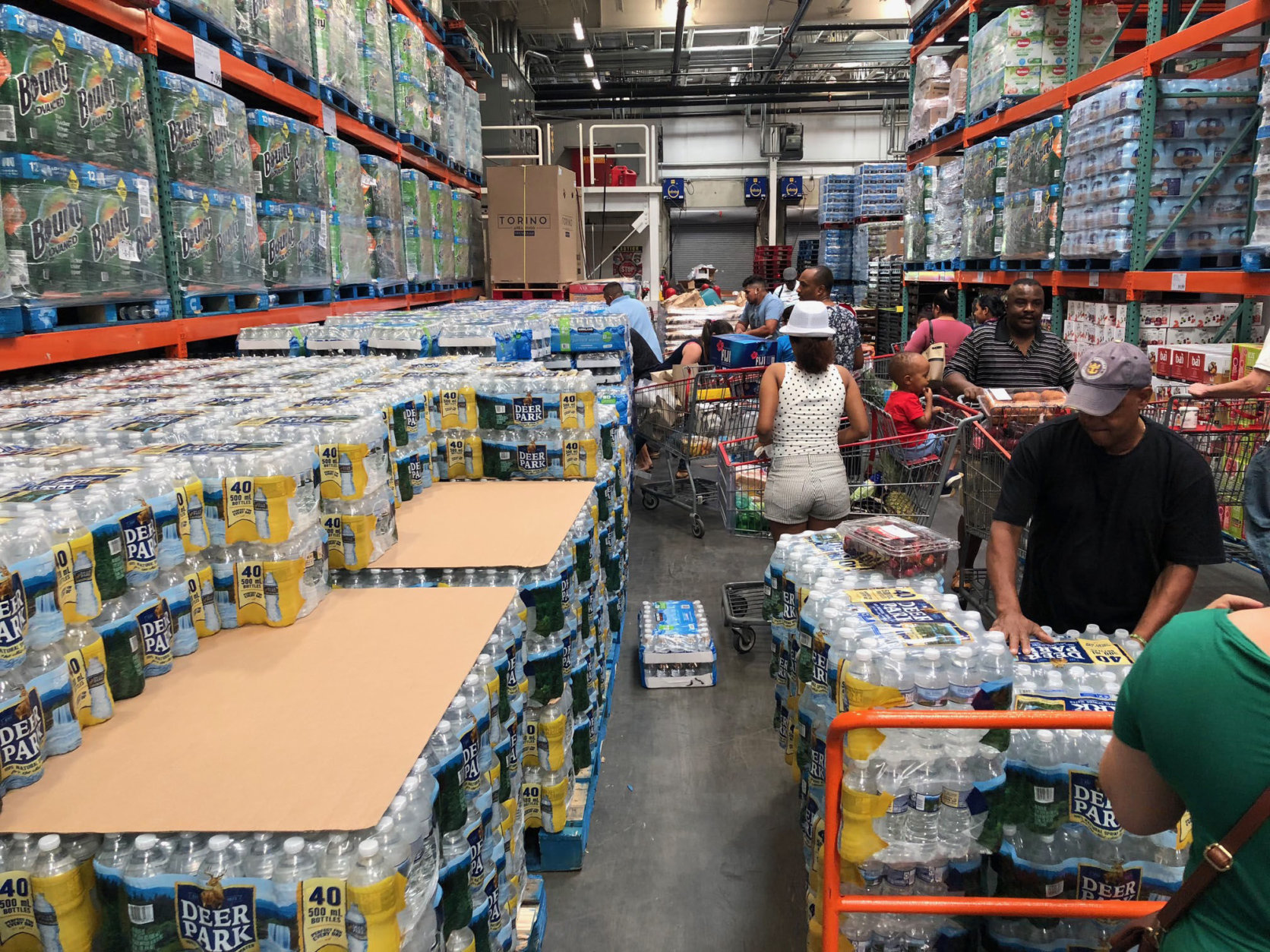 Customers stock up on bottled water at a Costco in Wheaton, Maryland, after a boil advisory is issued for  large parts of Northwest and Northeast D.C. June 13, 2018. (WTOP/Megan Cloherty)