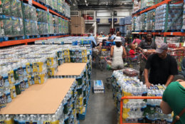 Customers stock up on bottled water at a Costco in Wheaton, Maryland, after a boil advisory is issued for  large parts of Northwest and Northeast D.C. June 13, 2018. (WTOP/Megan Cloherty)