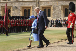 Britain's Queen Elizabeth II, left and US President of the United States, Donald Trump inspect the Guard of Honour, during the president's visit to Windsor Castle, Friday, July 13, 2018 in Windsor, England. The monarch welcomed the American president in the courtyard of the royal castle. (Chris Jackson/Pool Photo via AP)