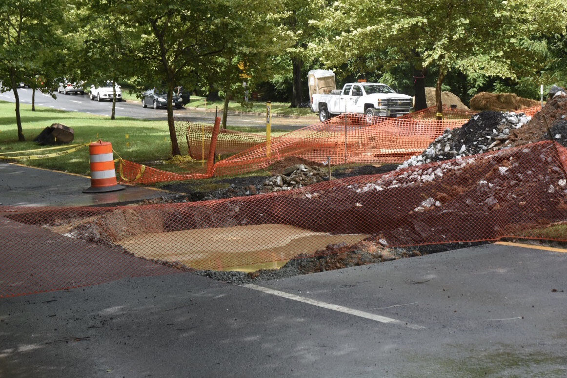 A rusted culvert failed late July 21, allowing the runoff from heavy weekend rains to erode the berm underneath the road. (WTOP/Dave Dildine)