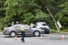 Authorities on the scene on Georgetown Pike, where a fallen tree snagged wires. (WTOP/Dave Dildine)