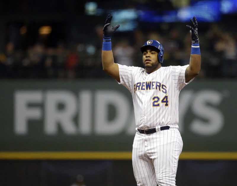 Milwaukee Brewers' Jesus Aguilar reacts after hitting a double during the fifth inning of a baseball game against the Atlanta Braves, Friday, July 6, 2018, in Milwaukee. (AP Photo/Aaron Gash)