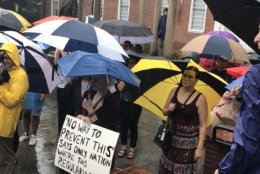 Standing in front of the state house in Annapolis, Maryland, on Saturday, dozens of Great Mills high school students and a survivor of the Capital Gazette shooting spoke out against gun violence. (WTOP/Melissa Howell)