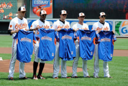 BALTIMORE, MD - JULY 14: Chris Tillman #30, Adam Jones #10, Chris Davis #19, J.J. Hardy #2 and Manny Machado #13 of the Baltimore Orioles pose for a photo with their All Star jersey before the game against the Toronto Blue Jays at Oriole Park at Camden Yards on July 14, 2013 in Baltimore, Maryland. (Photo by Greg Fiume/Getty Images)