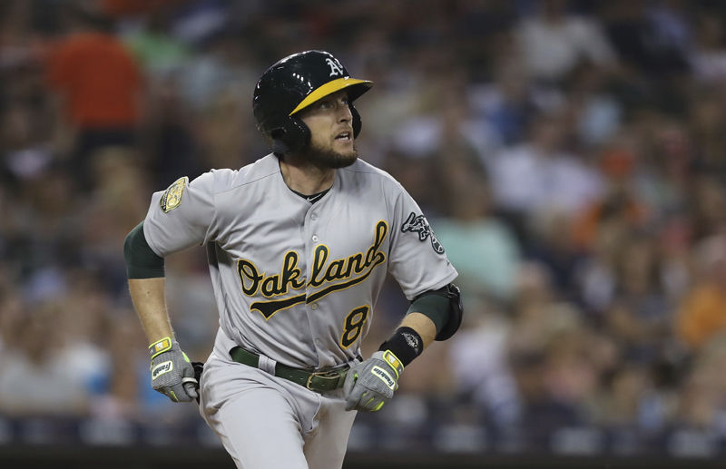 Oakland Athletics' Jed Lowrie watches his solo home run during the fifth inning against the Detroit Tigers in a baseball game Tuesday, June 26, 2018, in Detroit. (AP Photo/Carlos Osorio)
